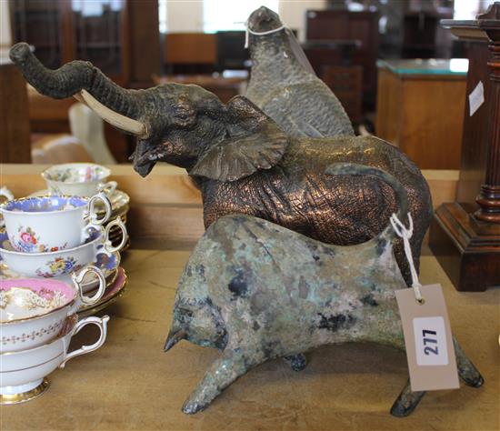 Stylised verdigris bronze figure of a charging bull, resin model of an elephant (a.f) & a carved soapstone bird